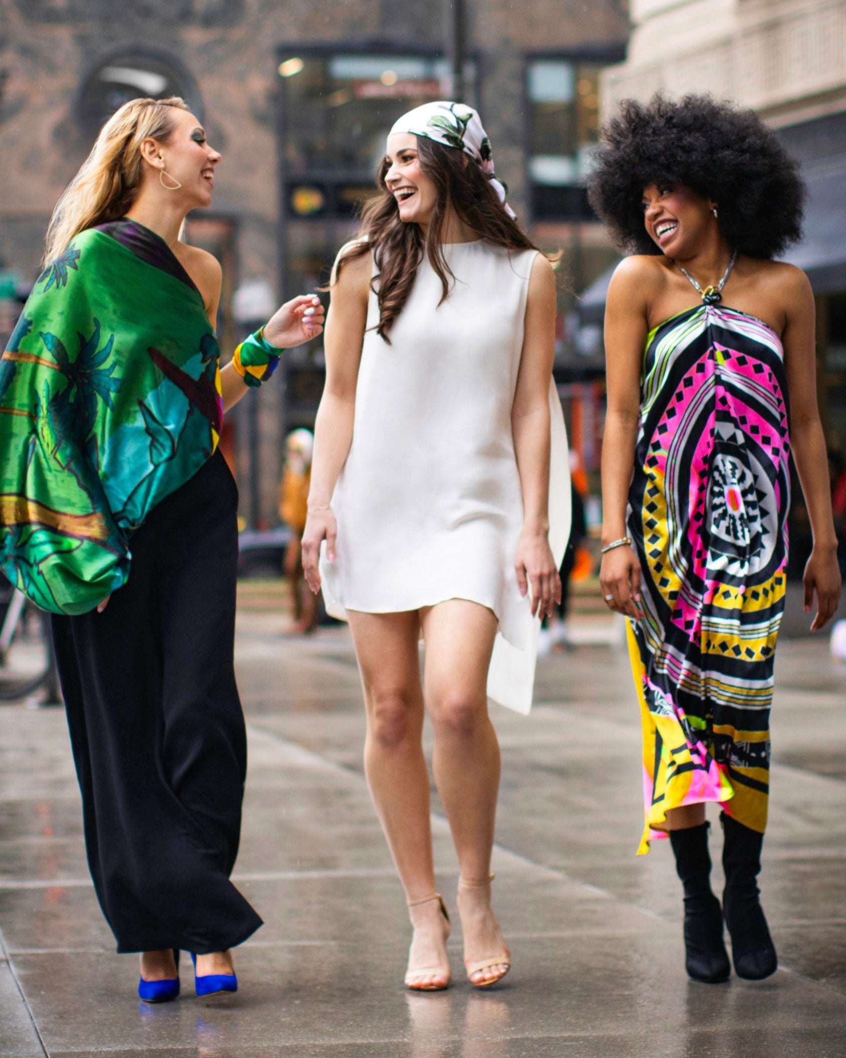 Women wearing MŌS, laughing